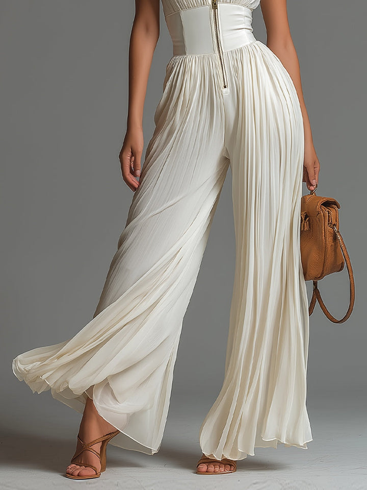 Luisa | Tuta bianca in chiffon senza maniche con cerniera, pieghe e gamba larga